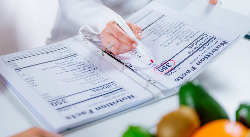Nutritionist with female patient Doctor nutritionist, dietician and female patient on consultation in the office